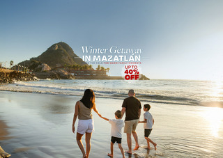 Family walking on the beach in Mazatlán